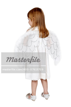 little girl with angel wings in back in the studio on a gray background