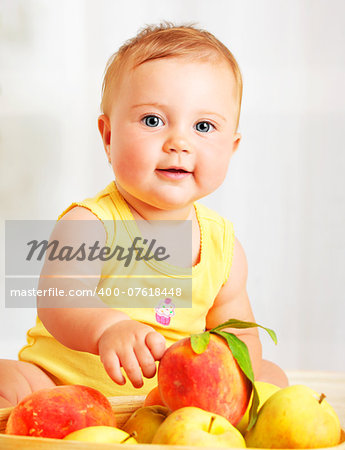 Little baby choosing fruits, closeup portrait, concept of health care & healthy child nutrition