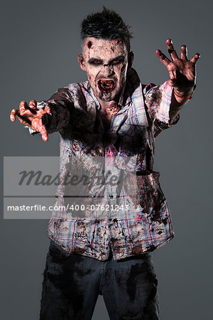 Aggressive, creepy zombie in clothes