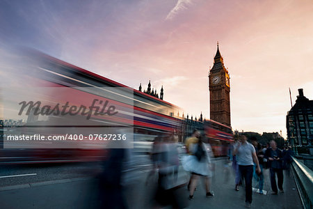 Slow motion blurred tourists and and traffic on Westminster Bridge with Big Ben in background, London.