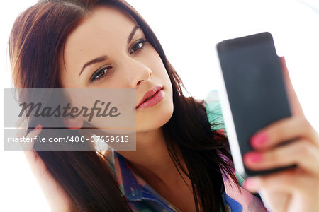 Cute, attractive teenager with mobile phone