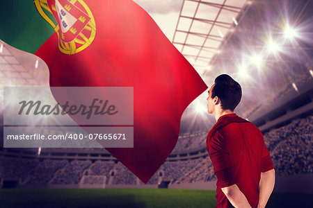 Football player in red jersey against football stadium