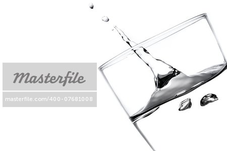 gush of water in a glass on white background