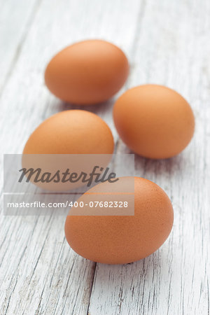 Eggs stack isolated on a wooden table