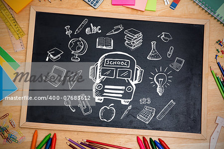 Composite image of education doodles against chalkboard