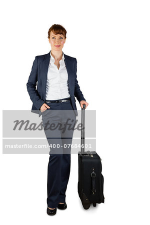 Smiling businesswoman holding her suitcase on white background
