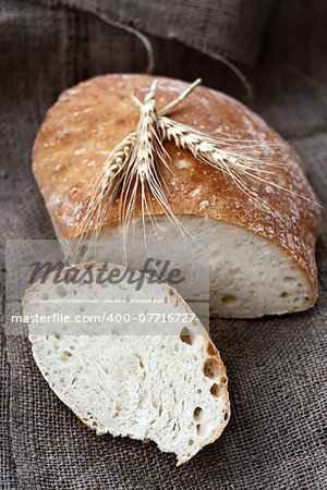 Homemade bread with ceral on rustic canvas