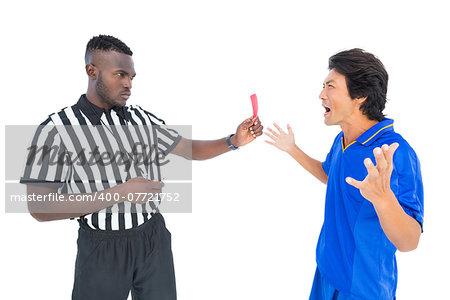Serious referee showing red card to player on white background