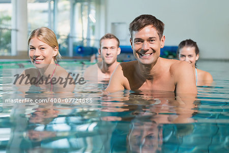 Fitness class using underwater exercise bikes in swimming pool at the leisure centre