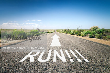 An image of a road to the horizon with text run