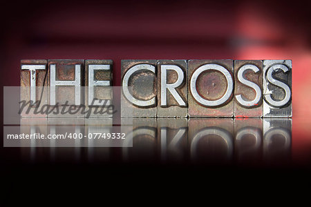 The words The Cross written in vintage letterpress type