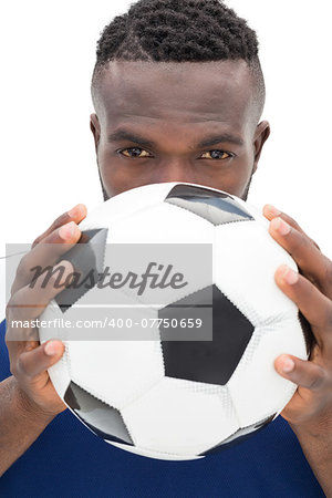 Close up portrait of a serious football player over white background