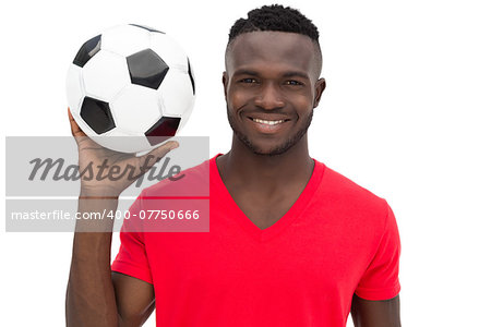 Portrait of a smiling handsome football fan over white background