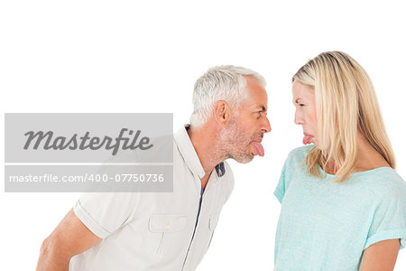 Mature couple arguing with each other over white background