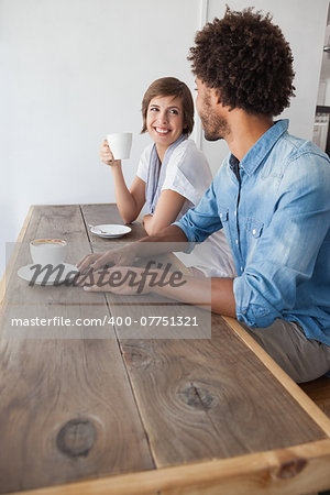 Casual friends having coffee together at the coffee shop