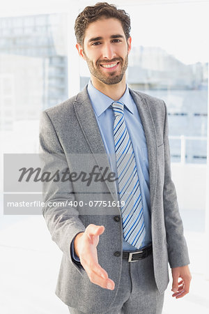 Businessman offering to shake hands at work