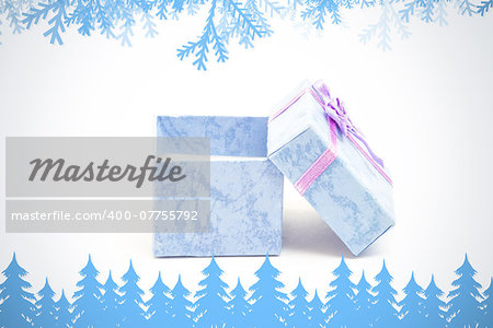 Frost and fir trees in blue against blue gift box with purple ribbon leaning against another