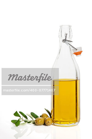 Luxurious olive oil background with fresh olives, branch and bottle with extra virgin oil isolated on white background. Culinary cooking concept.