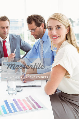 Young business people in board room meeting at office