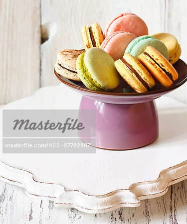 Fresh sweet macarons on a cake stand