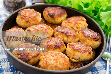 Delicious cutlets made of fish in a pan