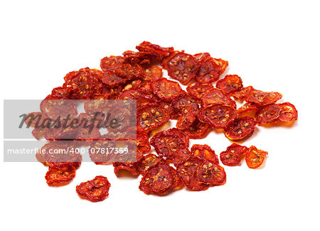 Dried slices of tomato. Isolated on white background.