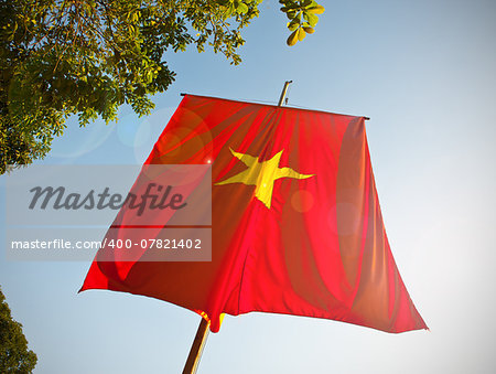 Vietnam flag with lens flare.