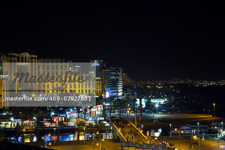 Eylat , Israel -: View on the Aqaba gulf and Eilat city at the evening . The view from the hotel window. Israel .