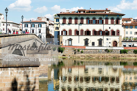 Image of houses and river Arno in Florence, Italy in autumn on a sunny day