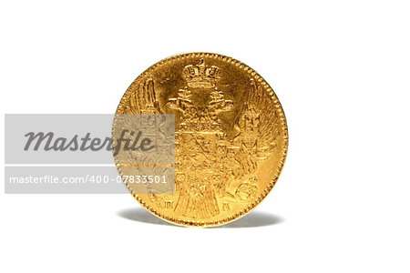 old gold coin isolated on a white background closeup