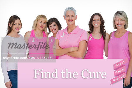 Enthusiastic women posing with pink tops for breast cancer against pink card