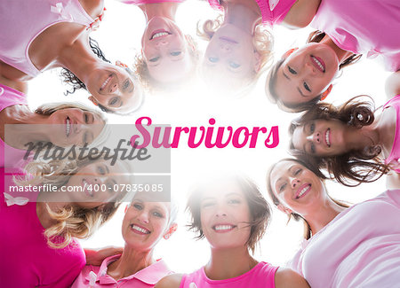 Group of happy women in circle wearing pink for breast cancer on white background