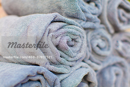 close-up of wrapped grey towels at spa or by the pool