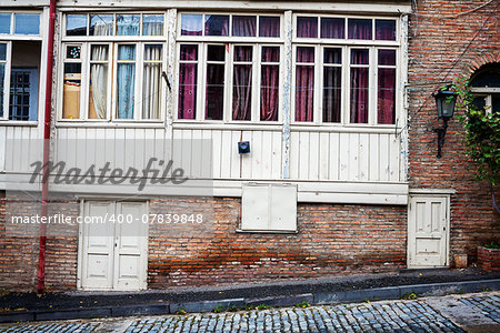 Aged weathered wall with some windows and doors