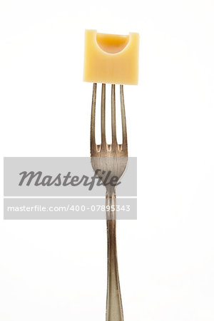 Emmental piece on fork isolated on white background.