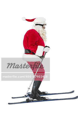Festive father christmas skiing on white background