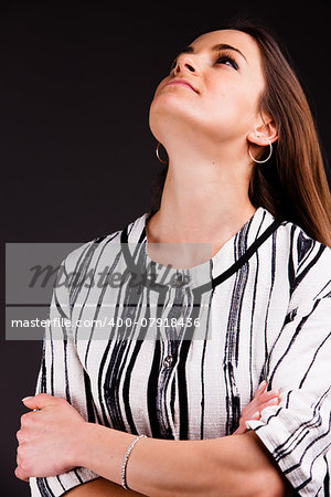 A long-haired beautiful self-confident woman posing