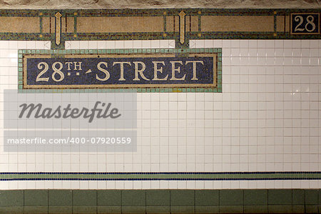 New York City Station subway 28th Street sign on tile wall. The NYC Subway is one of the oldest and most extensive public transportation systems in the world, with 468 stations.