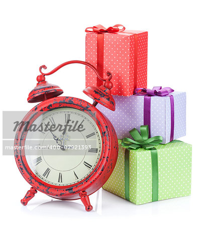 Christmas clock and three gift boxes. Isolated on white background