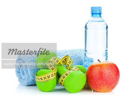 Two green dumbells, tape measure, apple and water bottle. Fitness and health. Isolated on white background