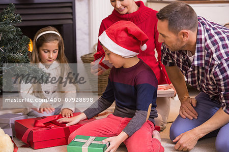 Love family opening gifts at christmas at home in the living room