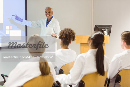 Science professor giving lecture to class at the university