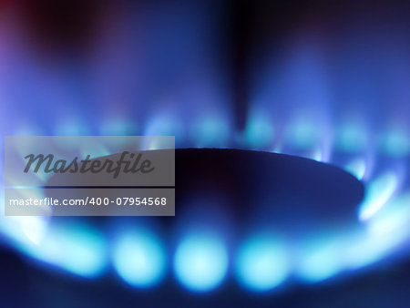 close up of a gas stove blue flame
