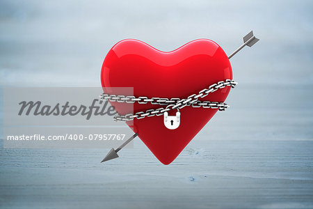 Locked heart against bleached wooden planks background