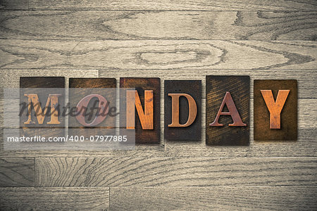 The word "MONDAY" written in wooden letterpress type.