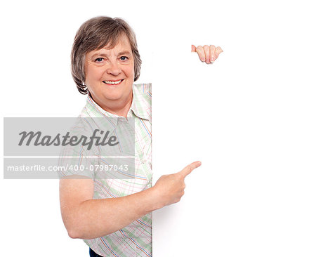 Attractive woman presenting an advertising board isolated against white background