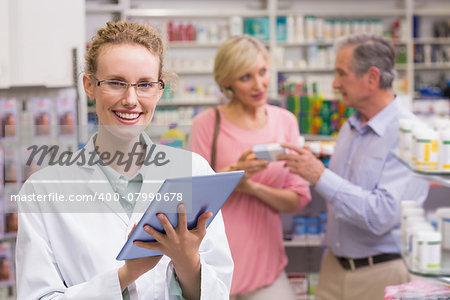 Pharmacist using tablet pc at the pharmacy