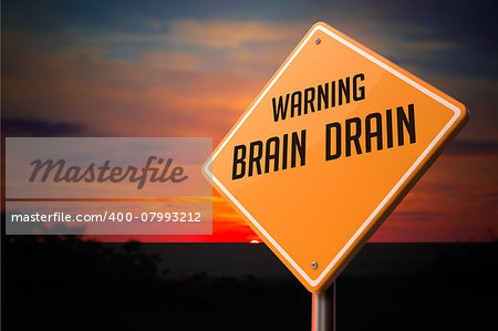 Brain Drain on Warning Road Sign on Sunset Sky Background.