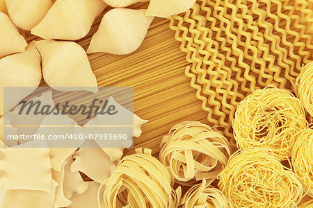 Italian spaghetti pasta dried food selection forming an abstract background.