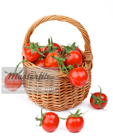 Arrangement of Perfect Ripe Cherry Tomatoes with Stems in Wicker Basket isolated on white background